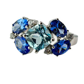 Silver ring with Sky topazes and synthetic stones